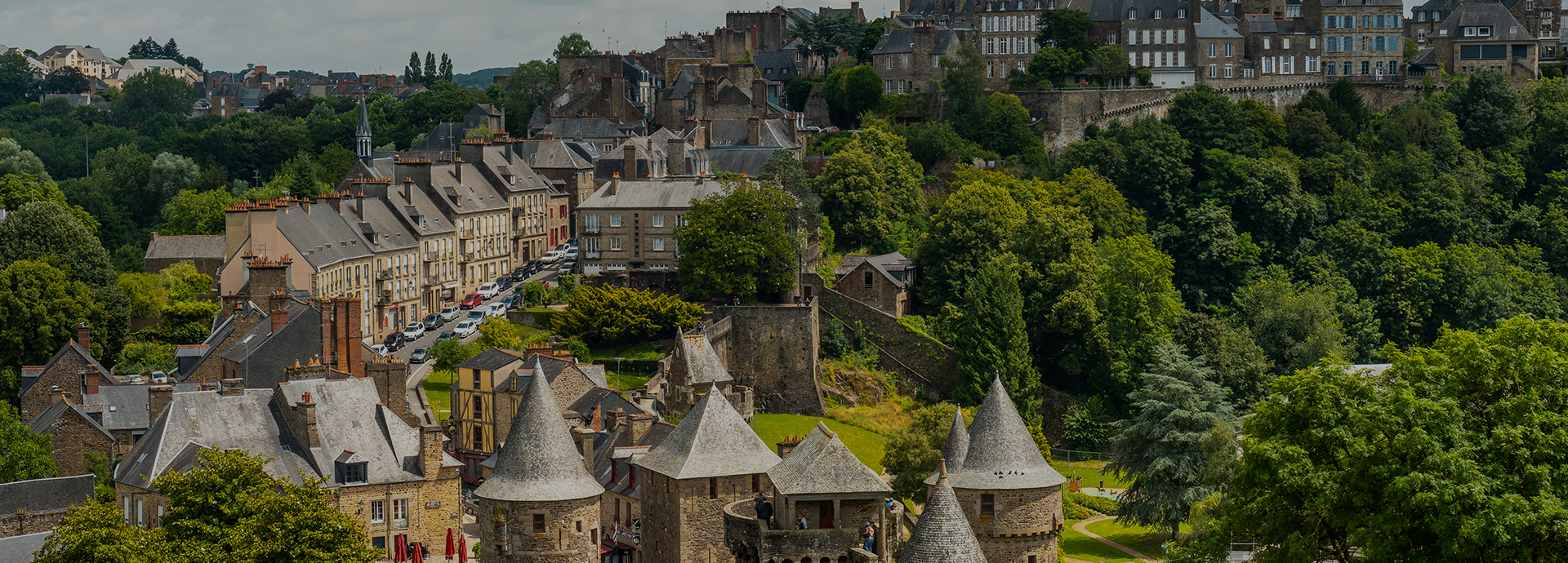 Interior of the castle of Fougeres and the city in the background. Brittany region